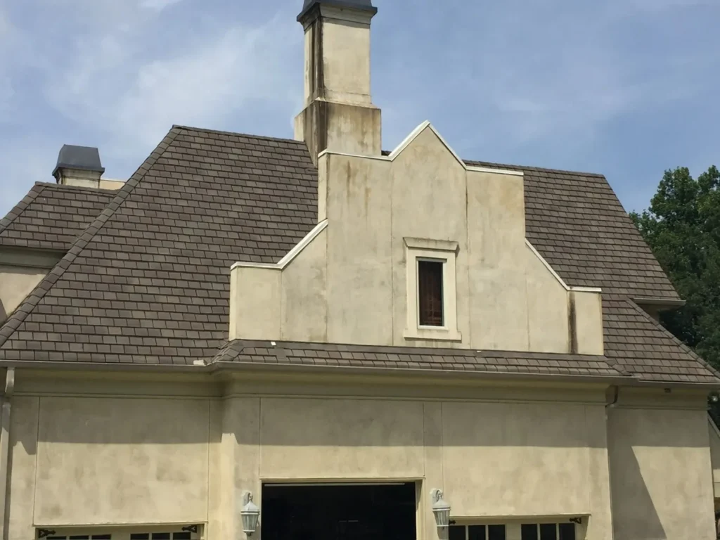 Clean residential roof surface with visible shingles showing condition before repair